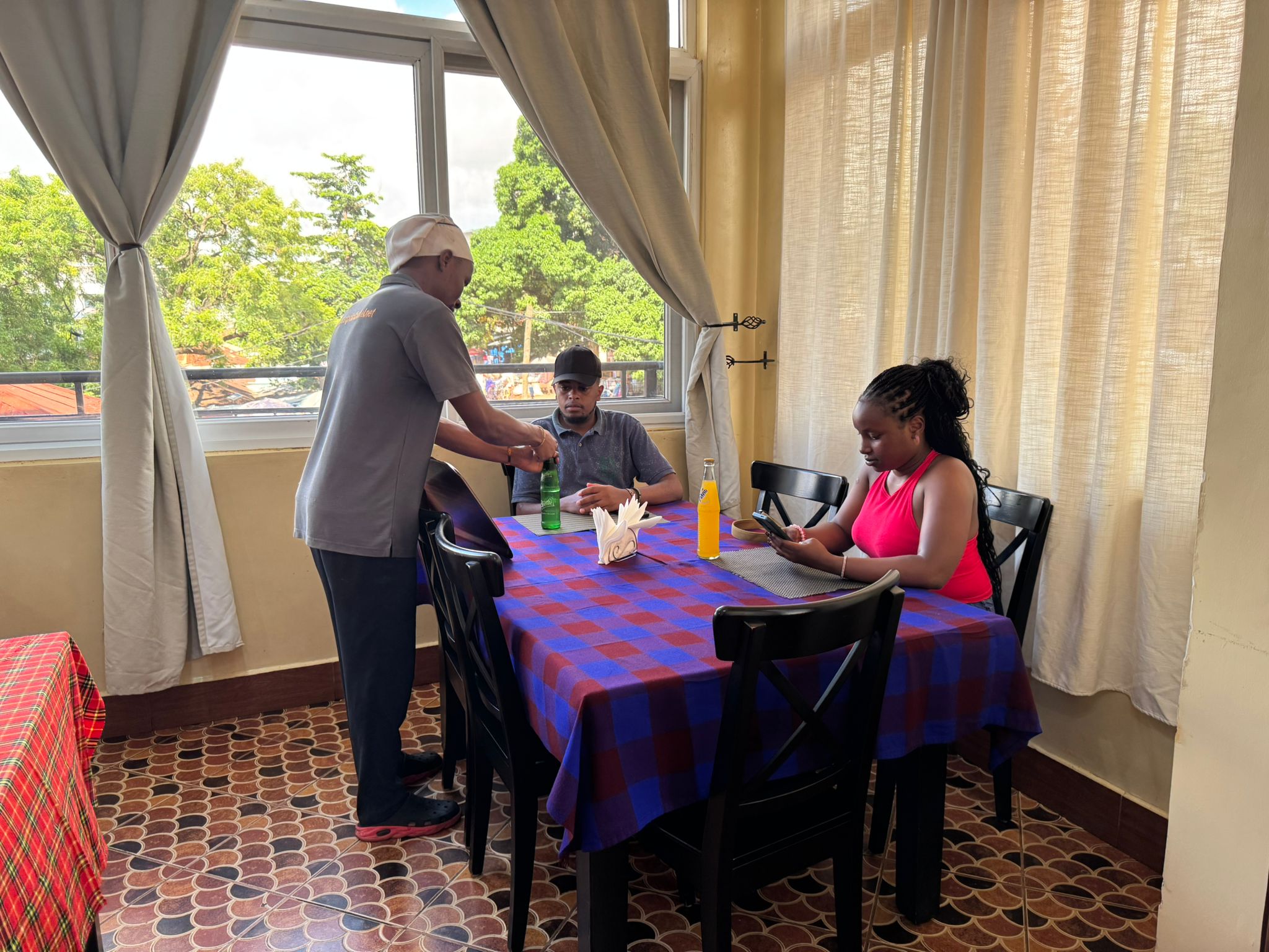 Dimart Solutions Team Unwinds at East Point Hotel After a 4-Day Safari Adventure. 2 Taking Breakfast